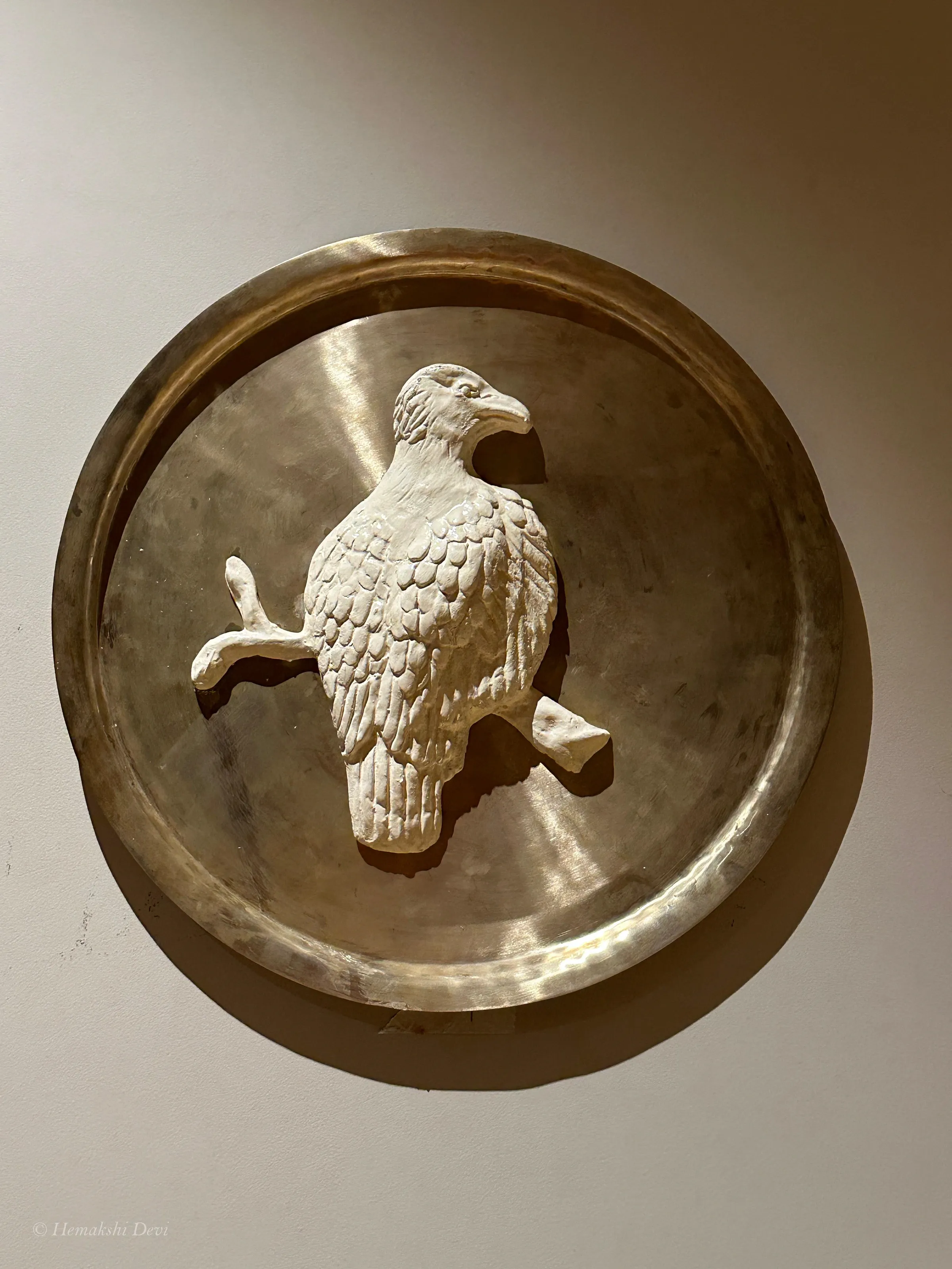Detail of a bell-metal medallion with a Kaziranga bird relief